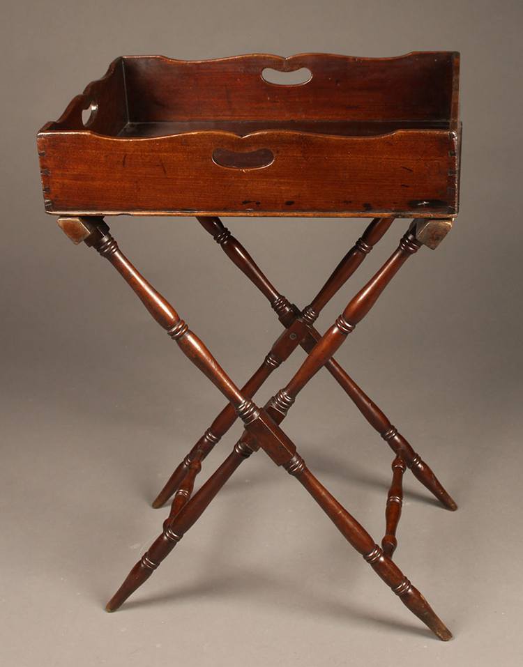 Antique butler’s table with handled mahogany top tray and folding base.