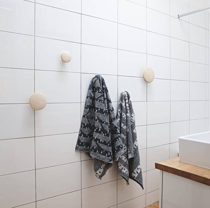 Hang the knob right on a suitable spot in bathroom to hold your towel.