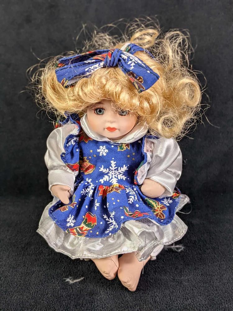 McField International Sitting Porcelain Doll