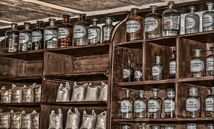 An array of antique medicine bottles with intact labels