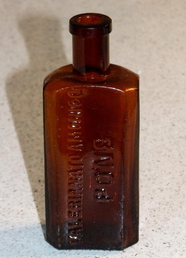 An example of an antique medicine bottle colored dark amber