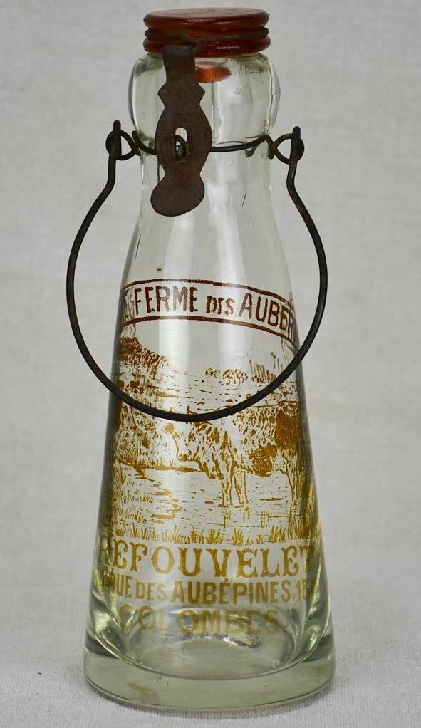 1. Antique French glass milk bottle with brown decoration