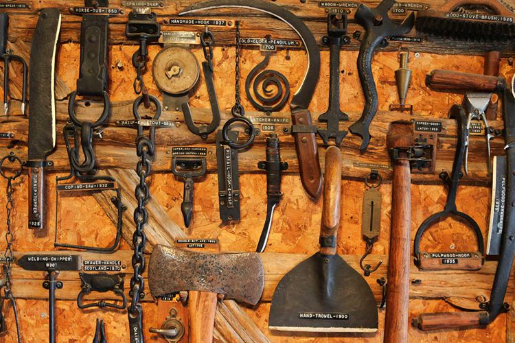 assorted antique farm tools