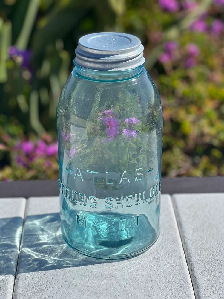 A Blue Hazel Atlas Strong Shoulder Mason Jar