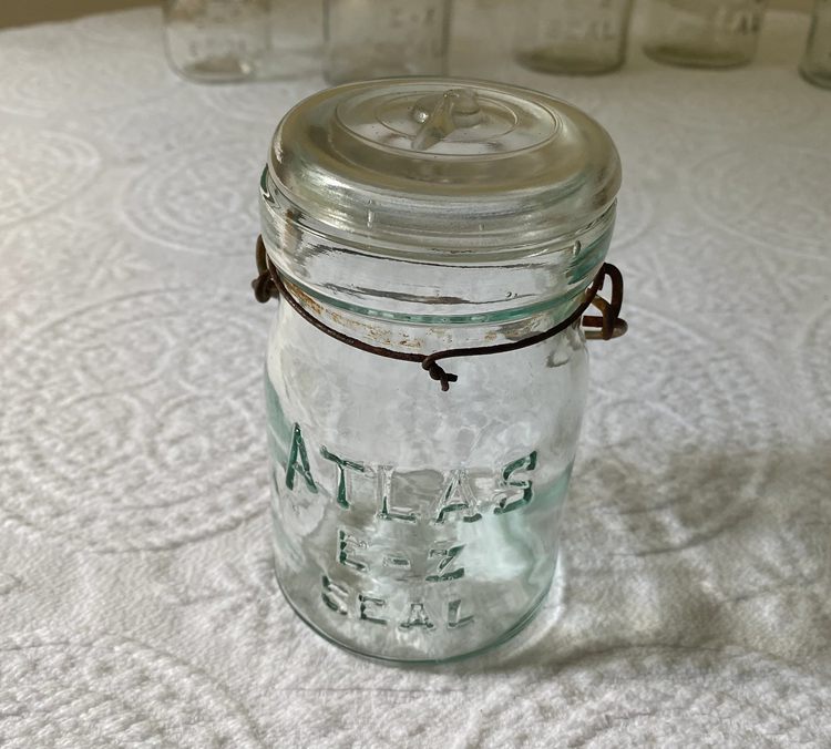 A Clear E-Z Seal Atlas Mason Jar with Glass Lid