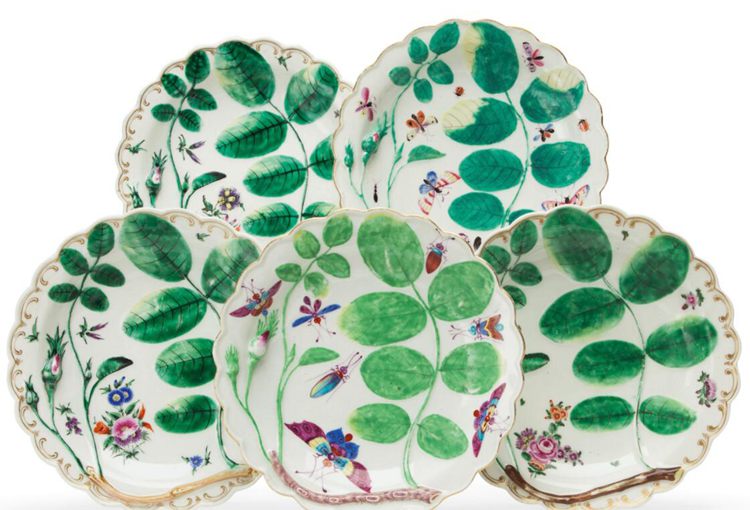 Five plates with green leaves design