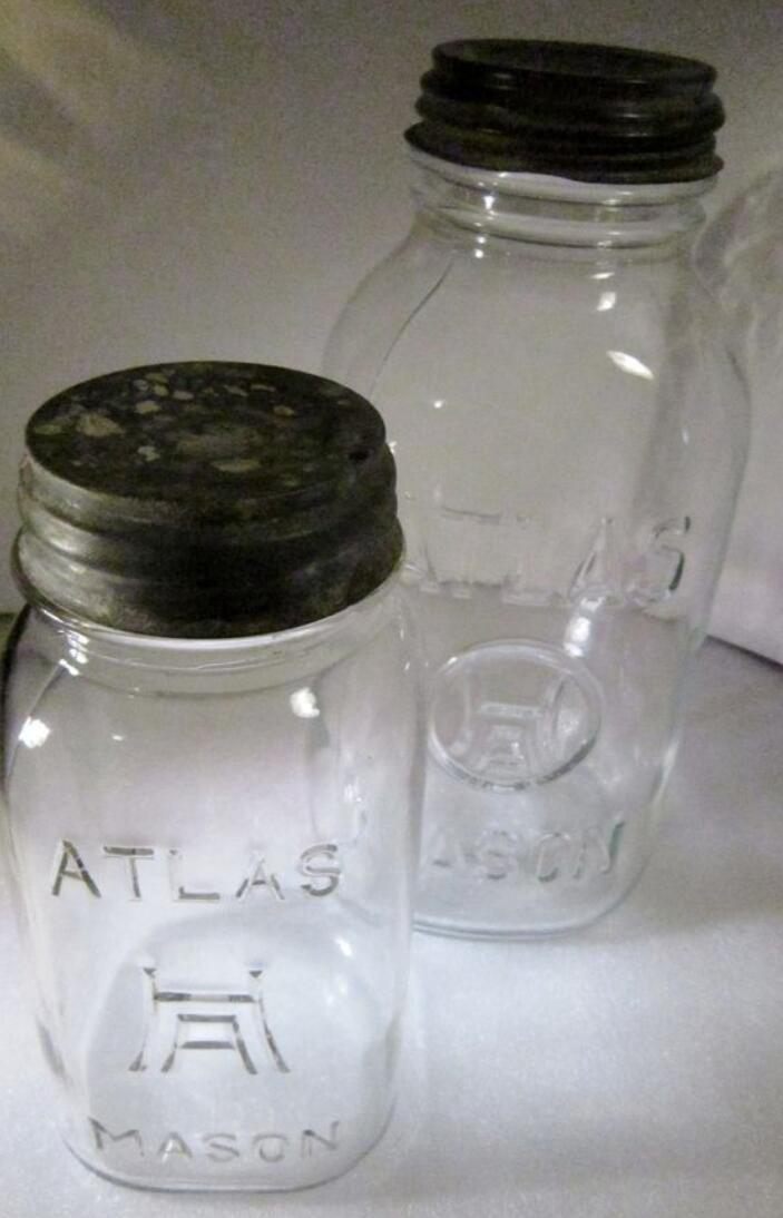Two Atlas H over A Mason Jars With Black Lids