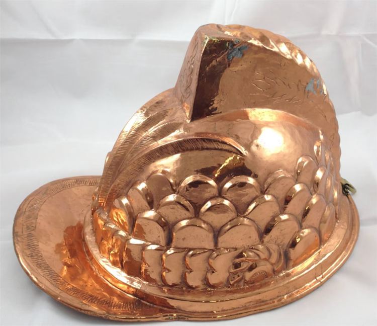 this pre-owned copper coated helmet mold