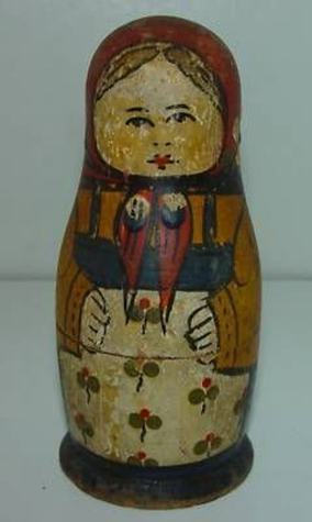 A matryoshka doll wearing a floral apron